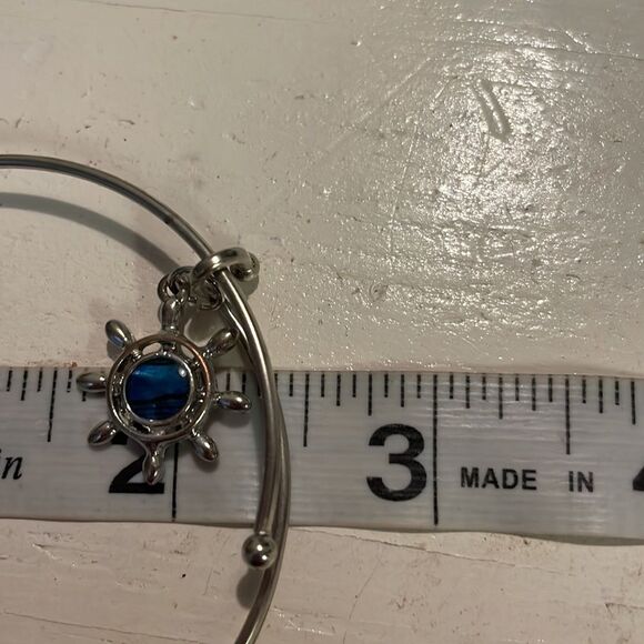 7.5” silver tone bangle bracelet with silver tone nautical charm - Picture 9 of 10